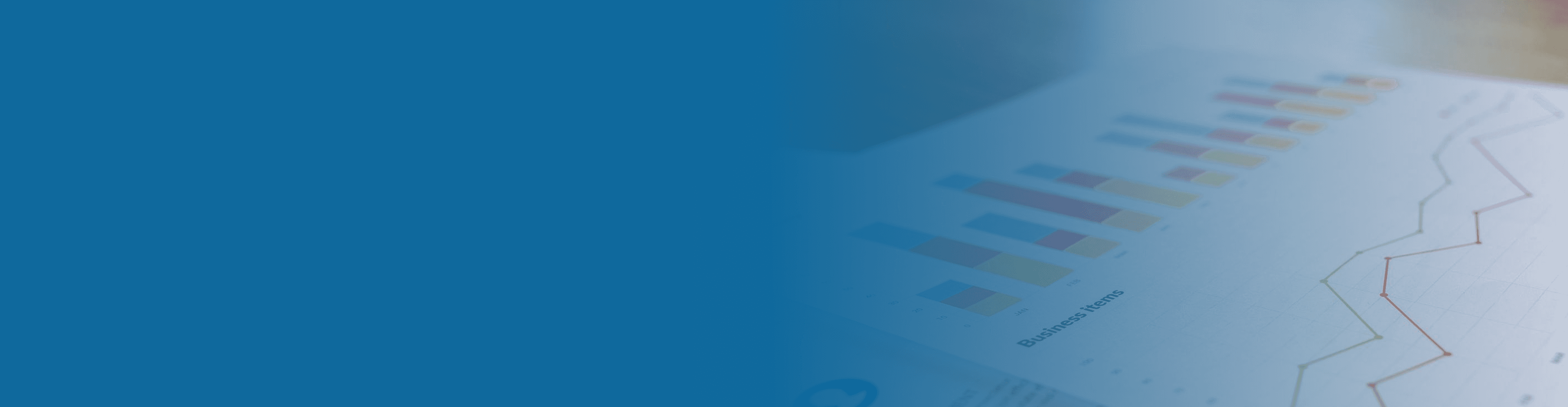 A smiling vendor packing a box on a shelf filled with packages.